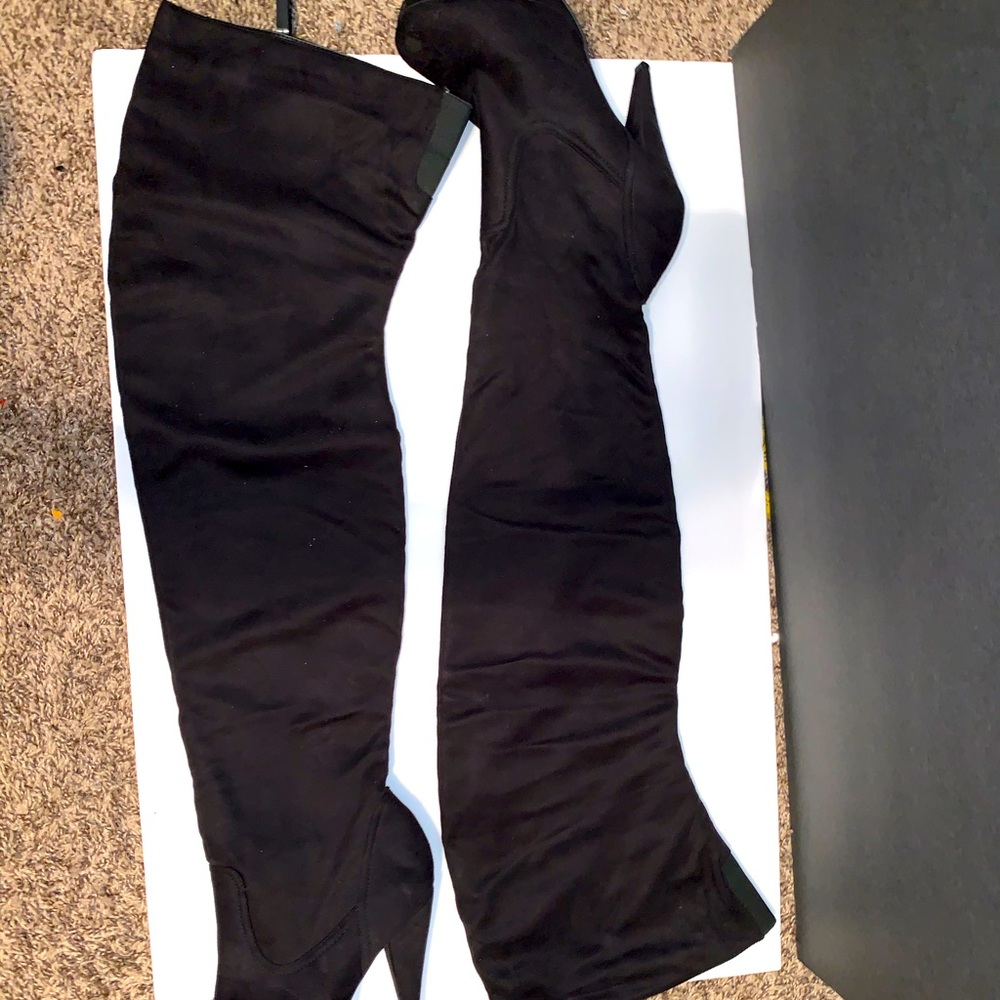 Thigh high heeled boots